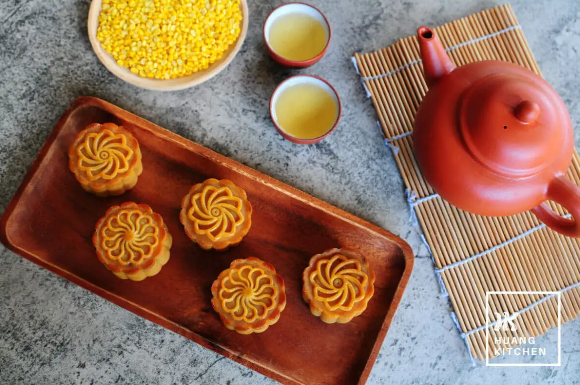 Baked Durian Mung Bean Paste Mooncake Recipe by Huang Kitchen - Top down view of mooncakes with teapot and chinese tea in background
