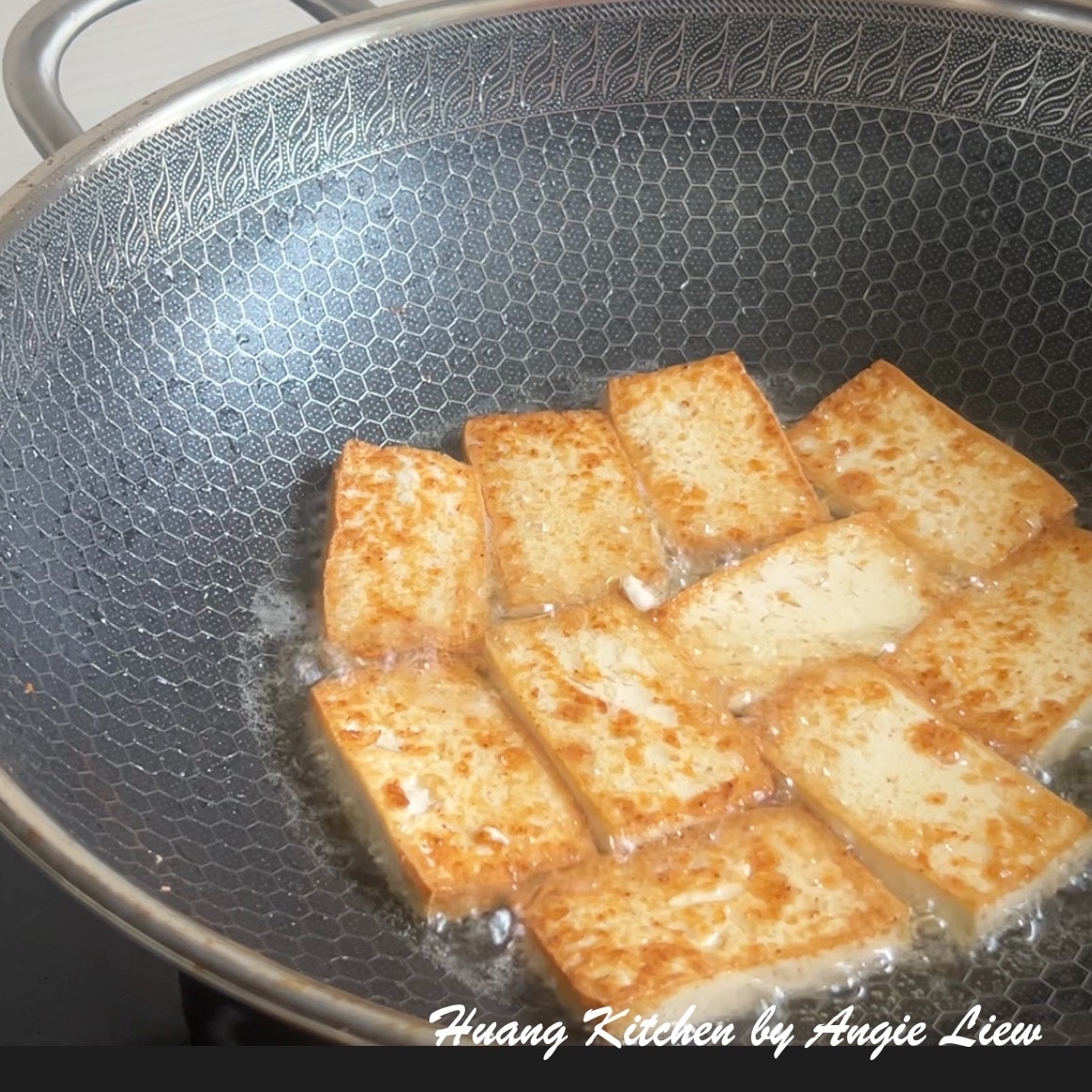 Fry tofu till slightly golden.