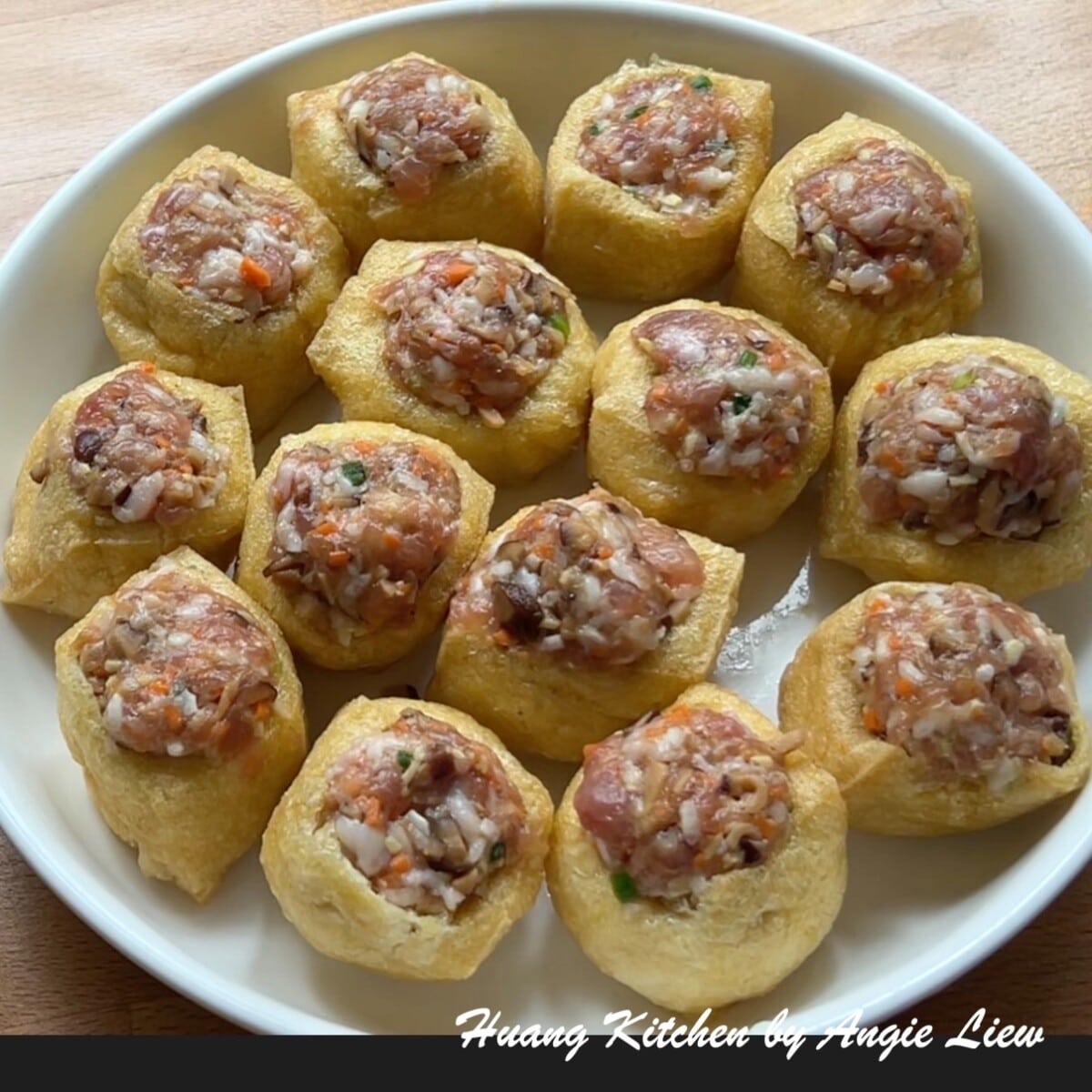 Stuff fried beancurd with minced meat.