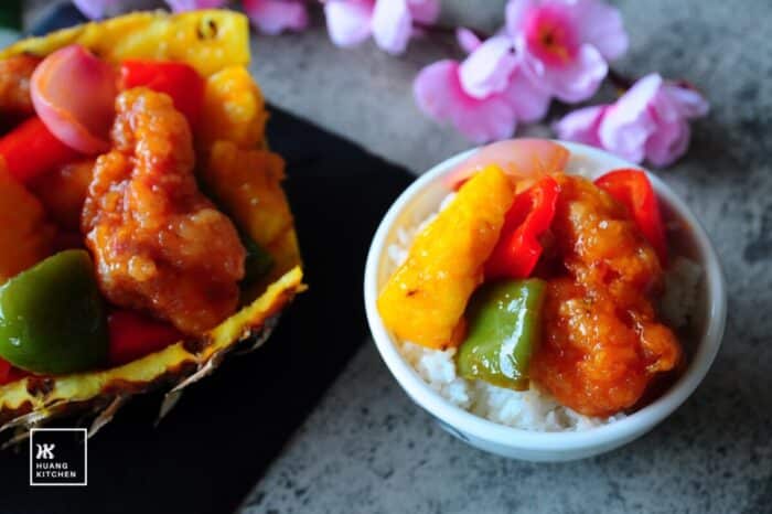 Chinese-style sweet and sour pork ribs with pineapple, enjoyed with steamed rice
