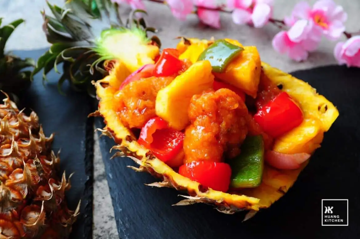 Sweet and Sour Pineapple Pork Ribs served in a hollowed pineapple shell